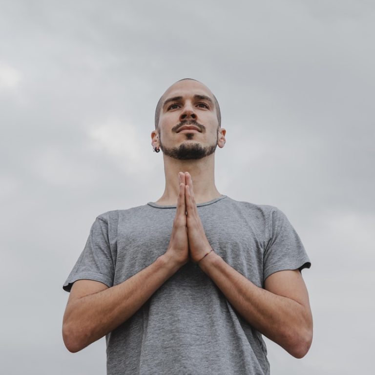 low-angle-man-outdoors-doing-yoga